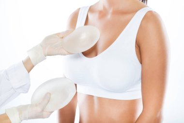 depositphotos 174906888 stock photo female doctor choosing mammary prosthesis